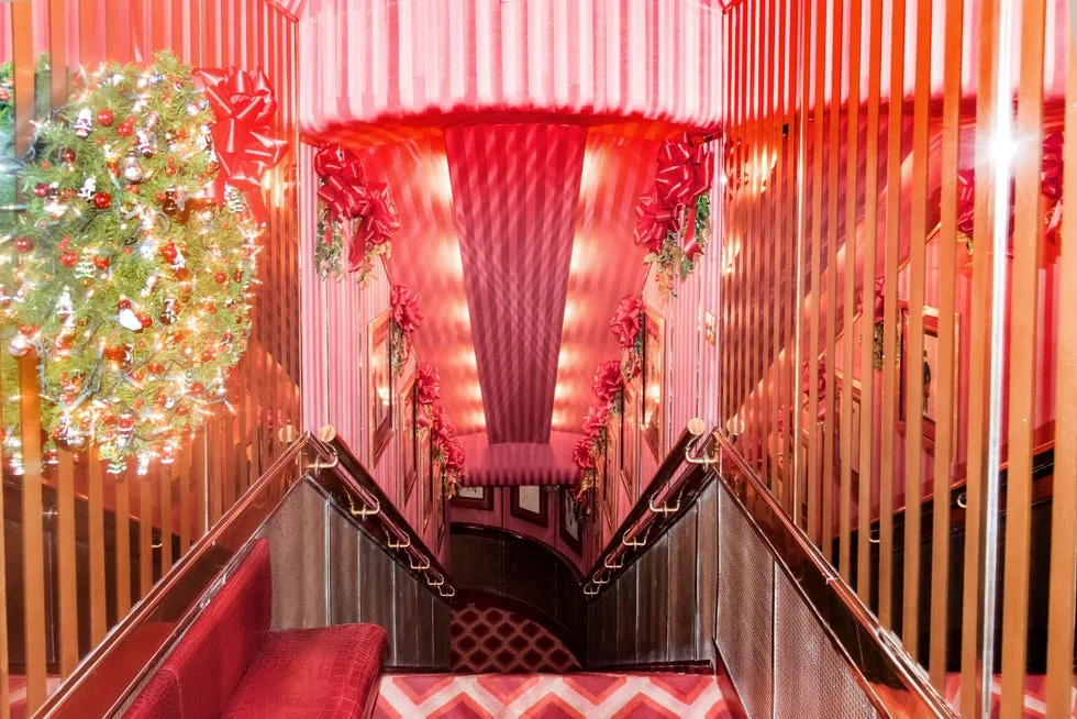 Red-carpeted staircase decorated for a party at Doubles in New York